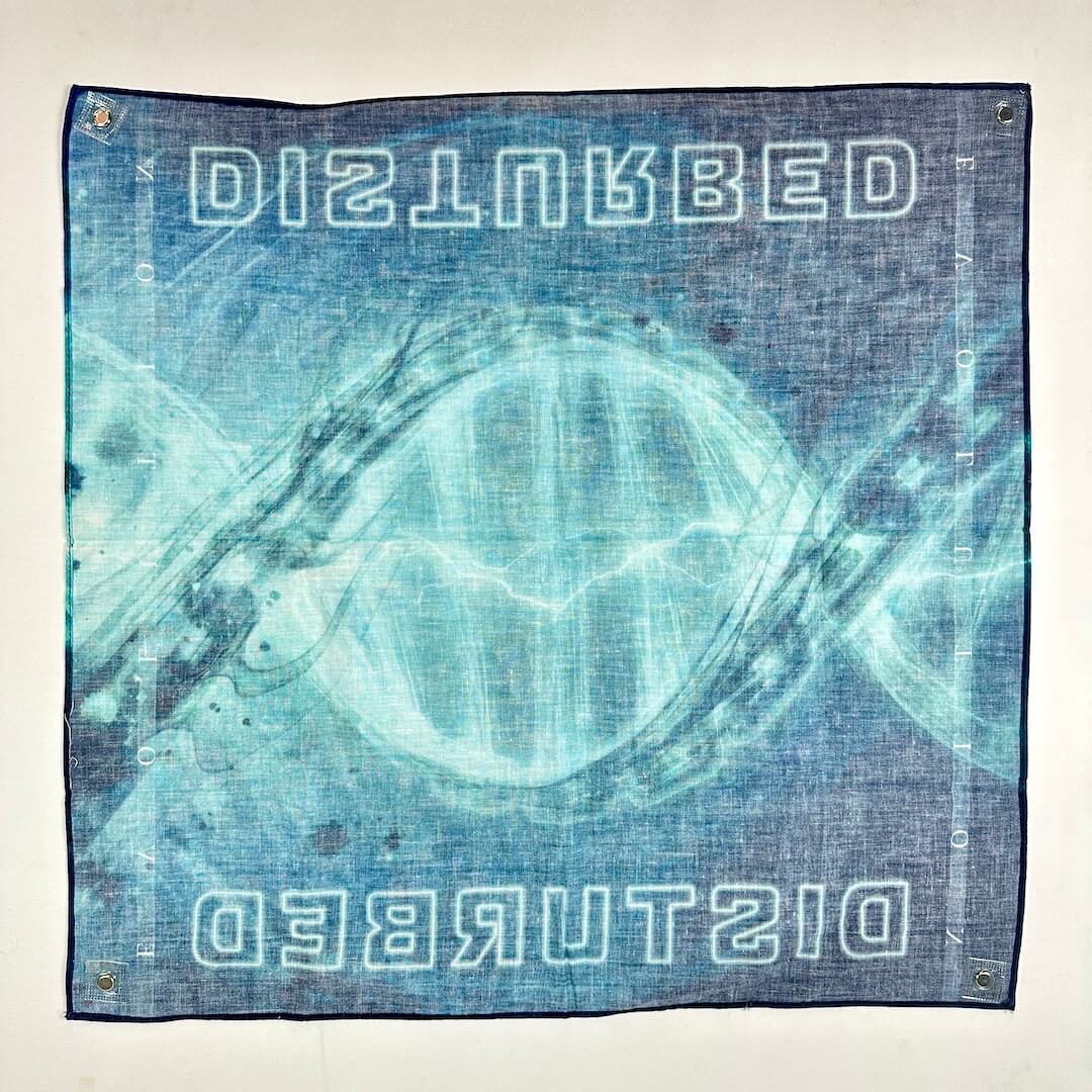 Back side of bandana with "Disturbed" branding on light background. 