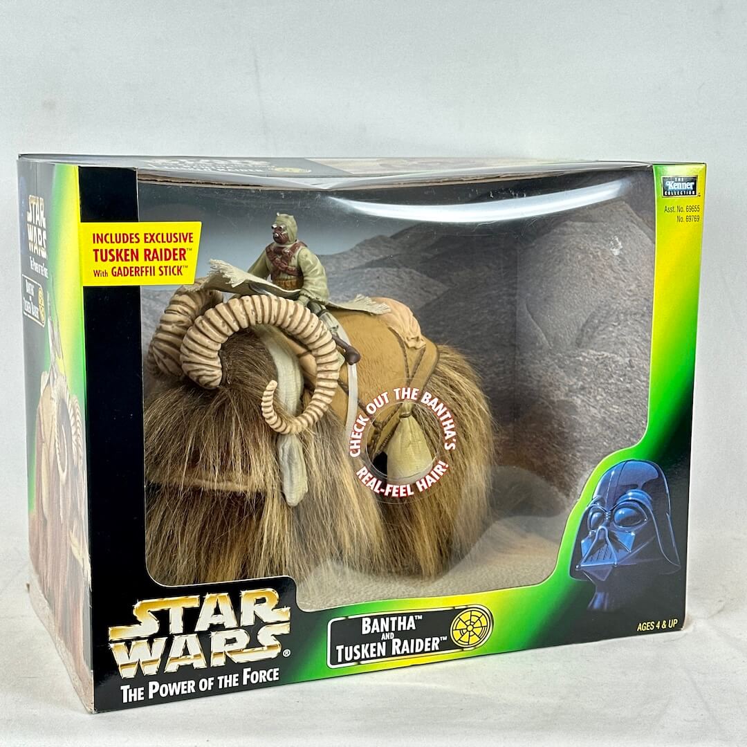 Star Wars Bantha Tusken Raider toy figure in packaging with text on a white background