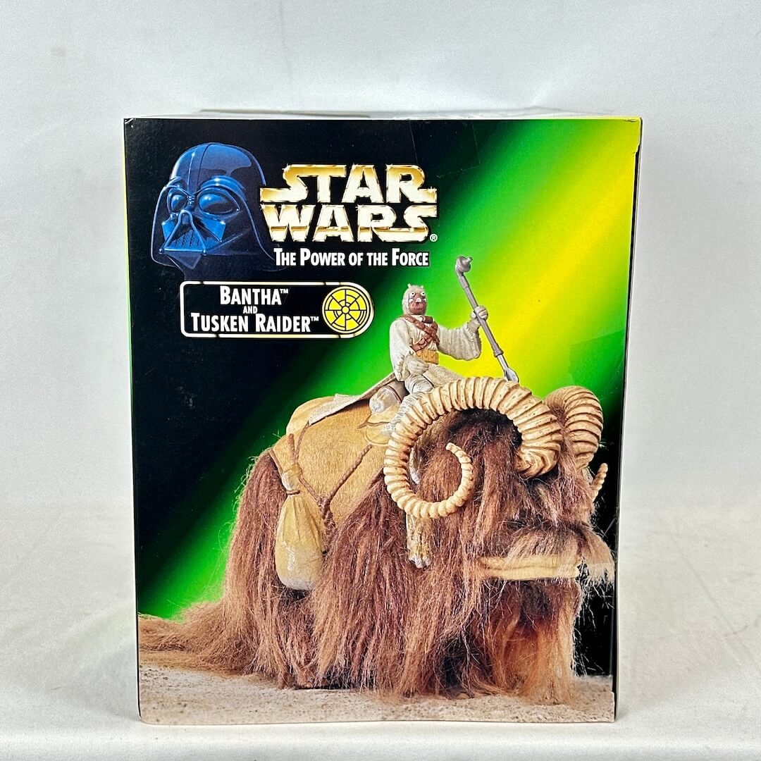 Star Wars toy box featuring a Tusken Raider and Bantha with branding on a white background