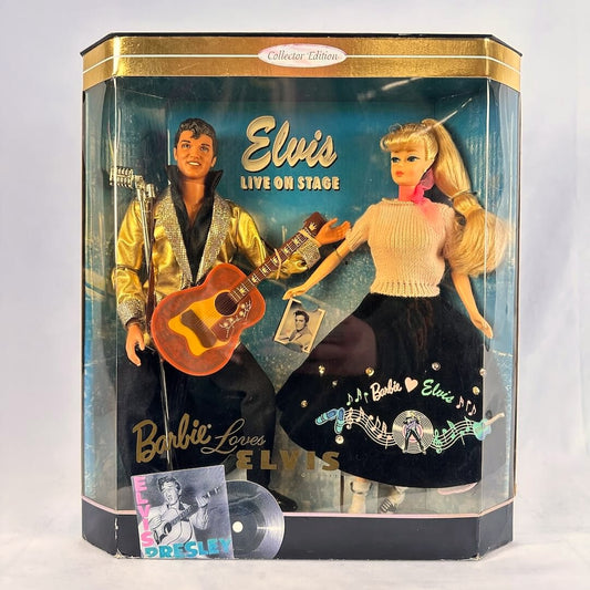 Barbie and Elvis doll inside packaging with accessories against gray background.