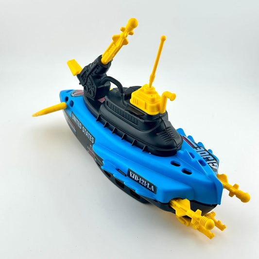 Toy submarine model with yellow periscopes and antennas on a white background