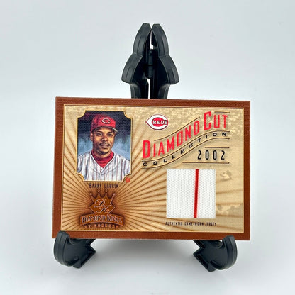 Baseball card with player image and 'Diamond Cut Collection' text on a wooden background