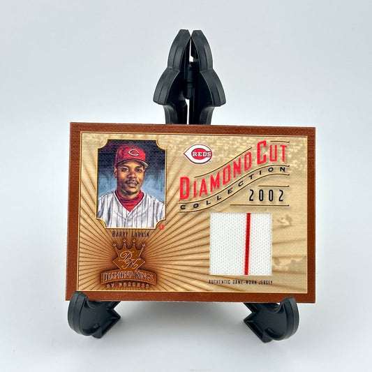 Baseball card with player image and 'Diamond Cut Collection' text on a wooden background