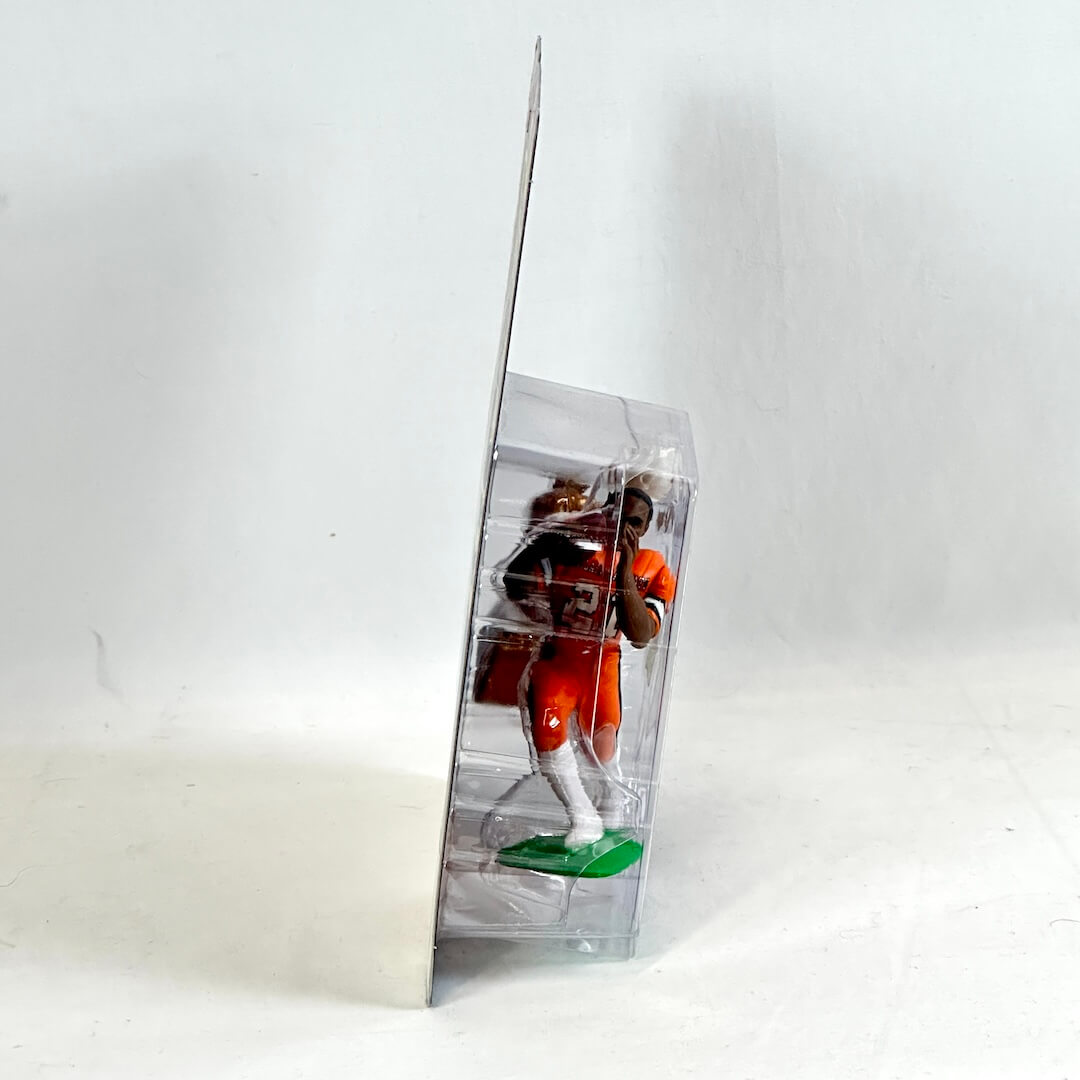 Action figure in a clear display case on a white background