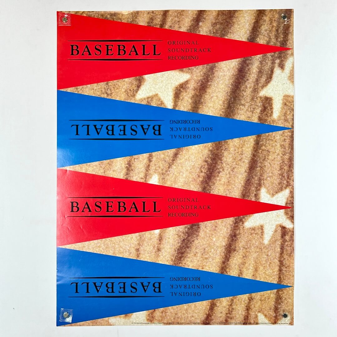 Four triangular flags with 'BASEBALL' text on a camouflage background