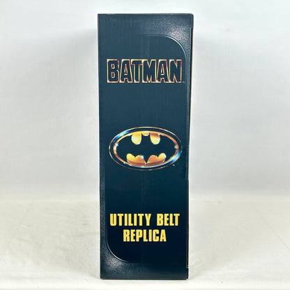 A tall, narrow product box for a Batman utility belt replica, featuring the Batman logo.