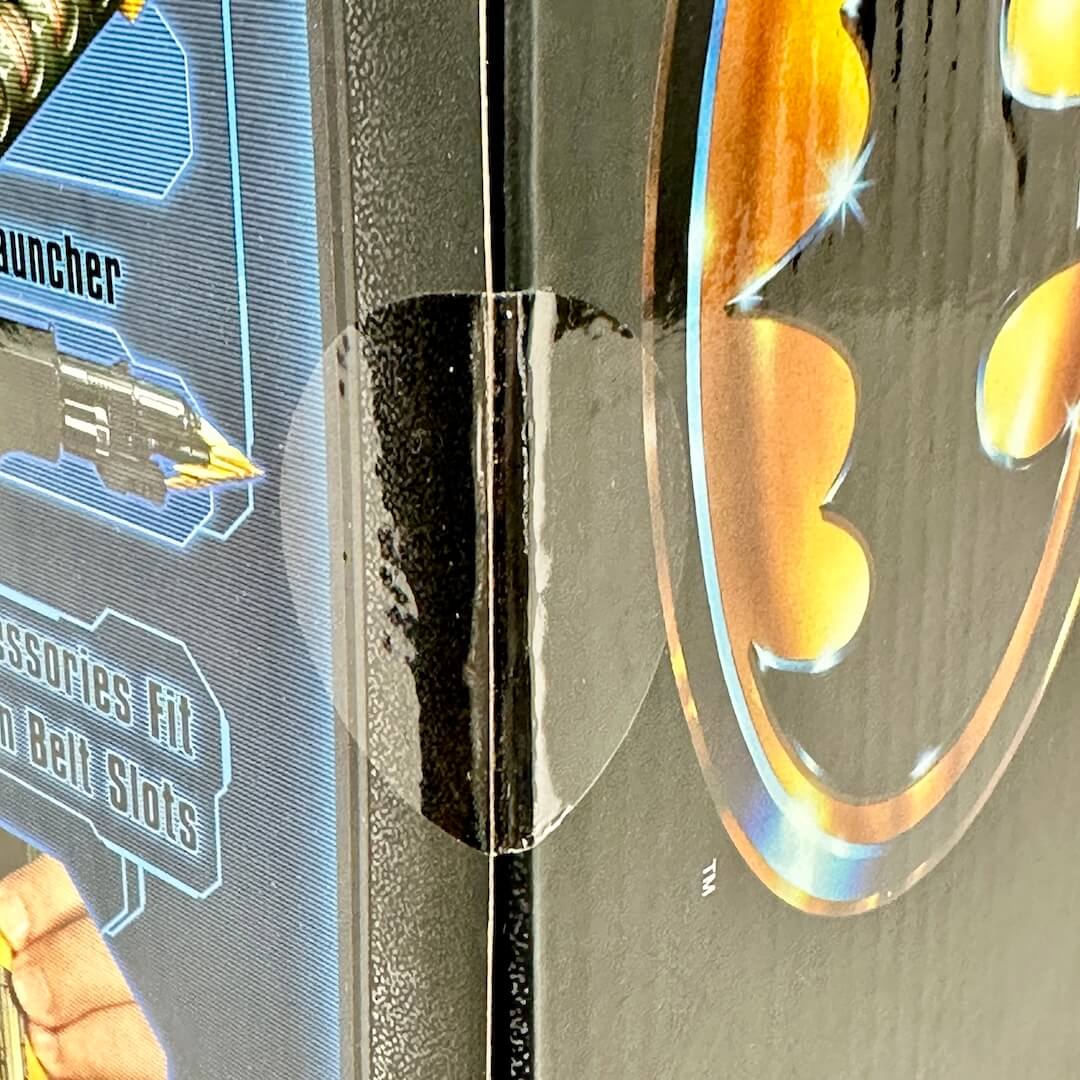 Close-up of factory seal sticker still intact. 