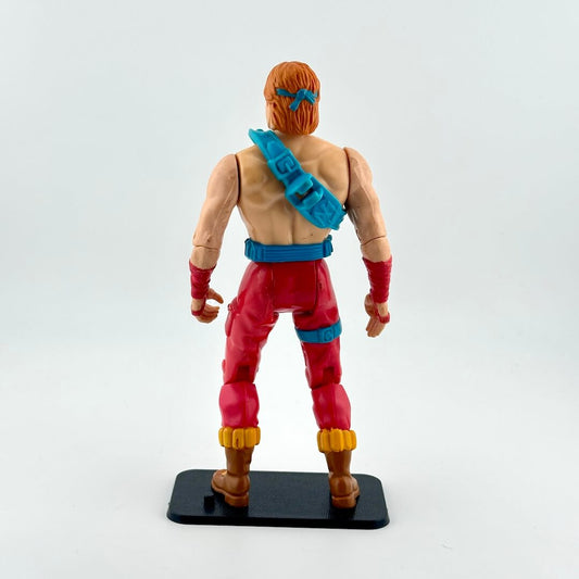 Action figure in red pants and blue accents against white background. 