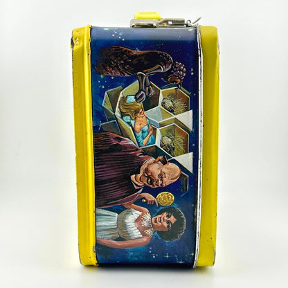 Side view of vintage lunchbox with characters from Battlestar Galactica in colorful illustrations. 