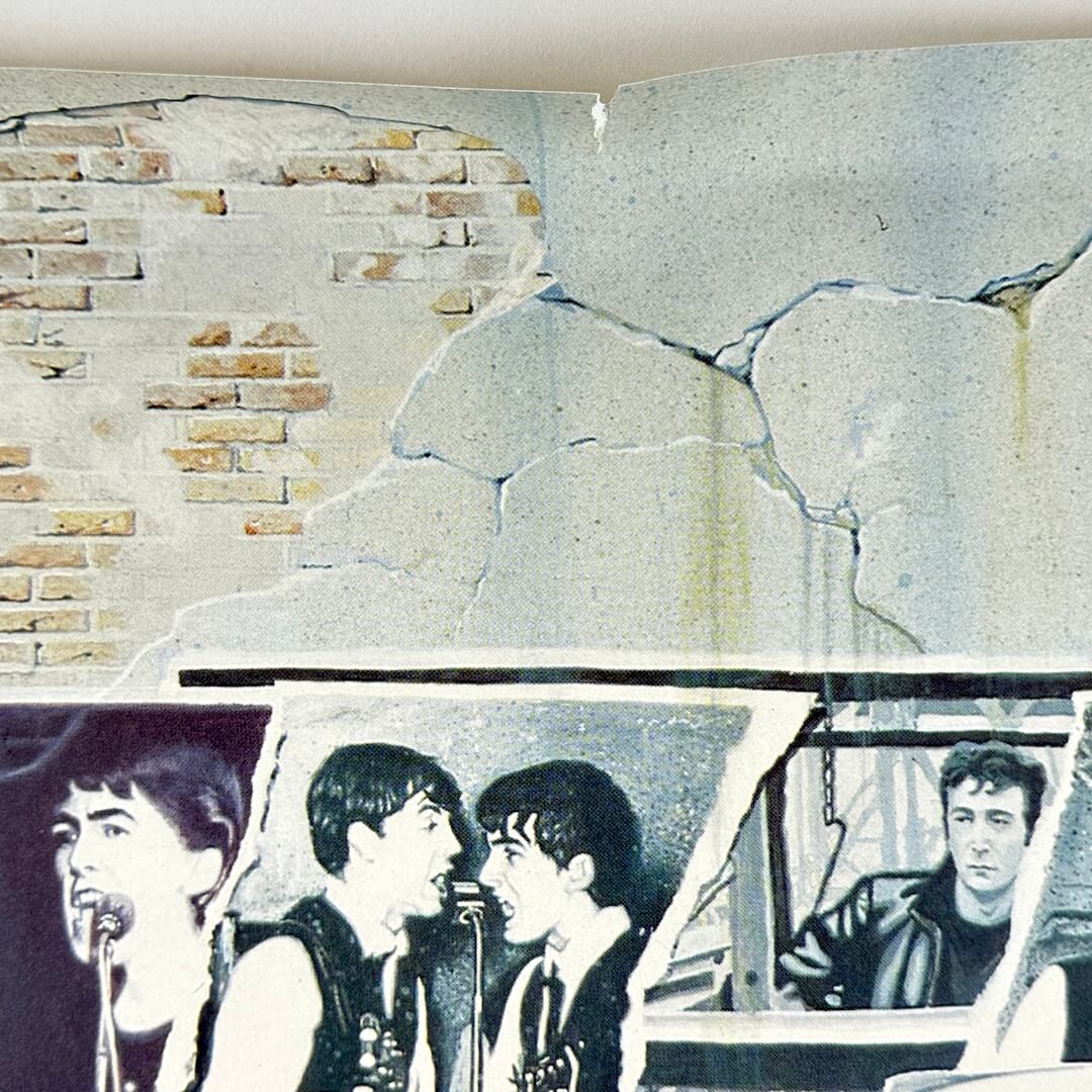 Middle of top edge showing quarter inch tear.