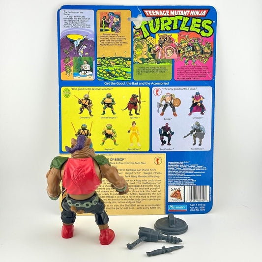 Action figure of Bebop with three accessories and card back on white background. 