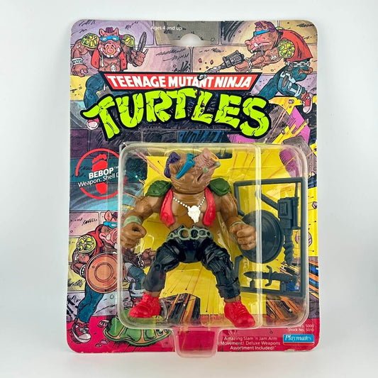Toy figure of Bebop from Teenage Mutant Ninja Turtles in packaging on a white background