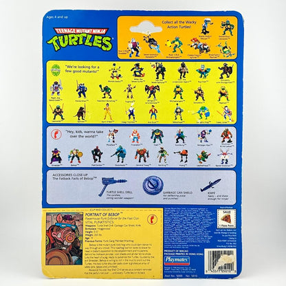 Back of a toy packaging featuring Teenage Mutant Ninja Turtles with character illustrations and text.
