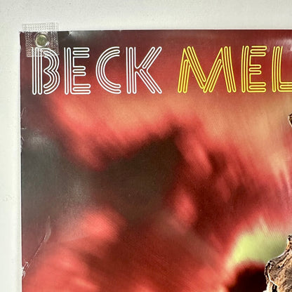 Top left corner of poster with crease and some edge wear visible. 