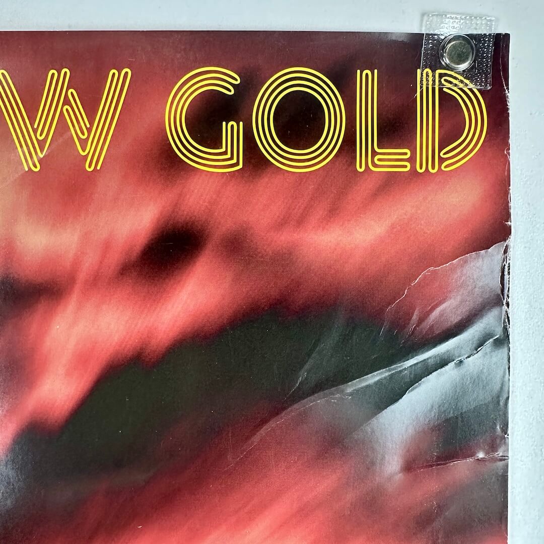 Top right corner with heavy edge wear and some creases.