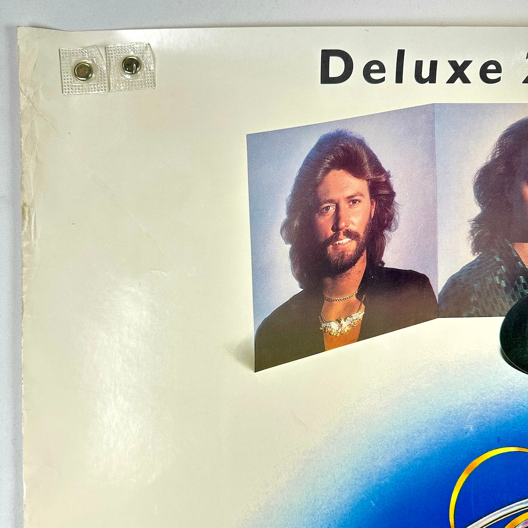 Top left corner with extreme edge wear along side. 