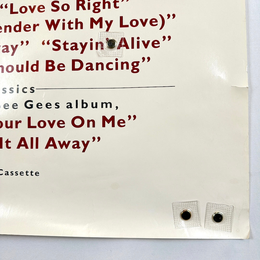 Bottom right corner of poster with half inch tear five inches above corner. 