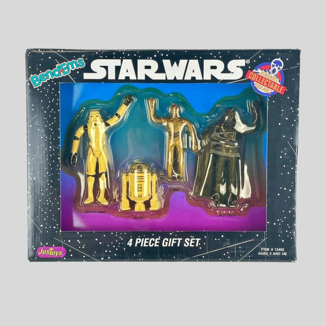 Star Wars collectible toy set in packaging with four figures including C-3PO, R2-D2, and Darth Vader.