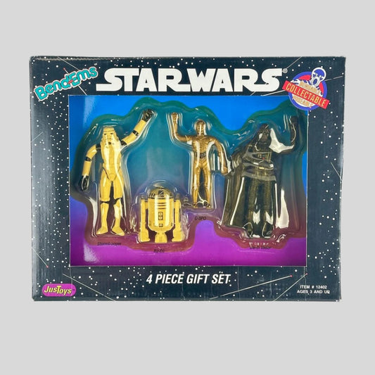 Star Wars collectible toy set in packaging with four figures including C-3PO, R2-D2, and Darth Vader.