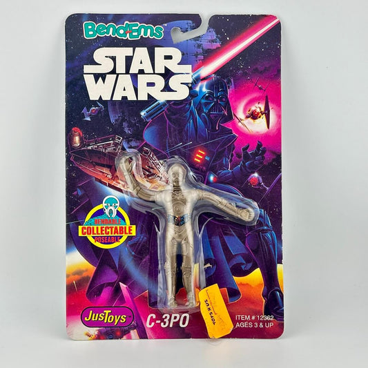 Vintage C-3PO toy figure in packaging with 'Star Wars' branding