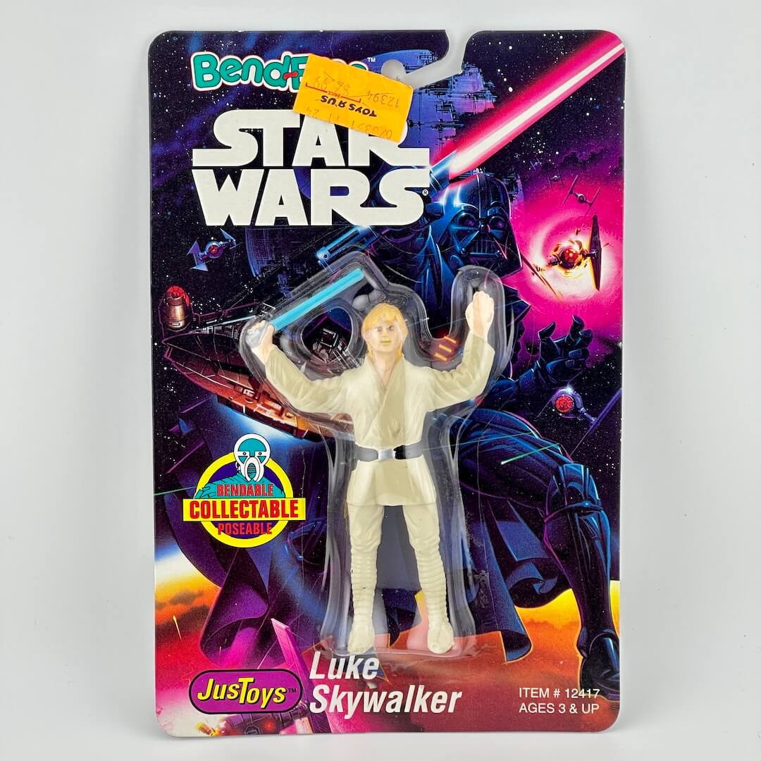 Star Wars action figure packaging featuring Luke Skywalker with a colorful space-themed background.