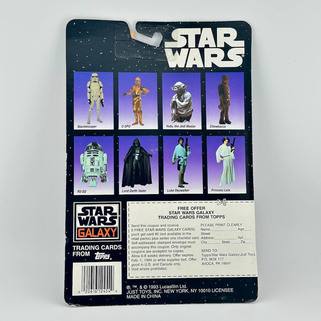 Vintage Star Wars action figure packaging with character illustrations on a gray background