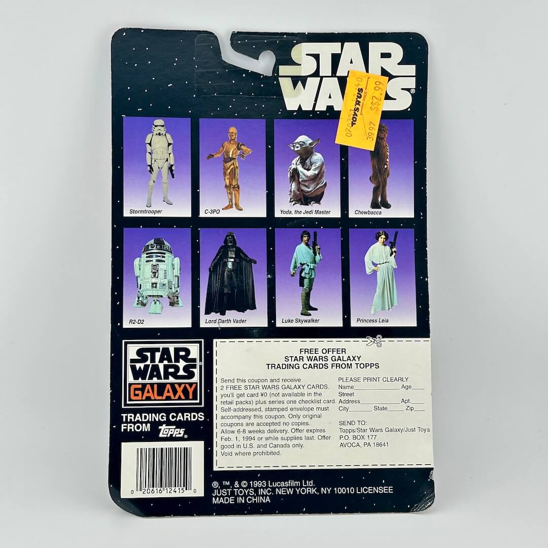 Vintage Star Wars action figure packaging with character illustrations and branding.