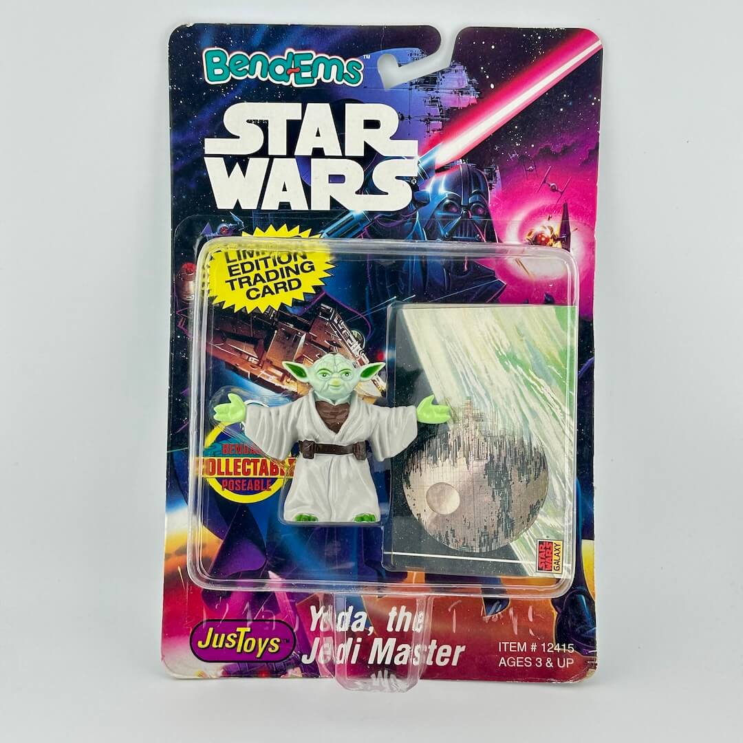 Star Wars Yoda action figure in packaging with colorful background