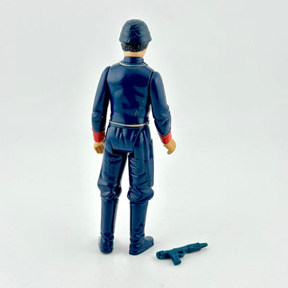 Action figure in blue suit with red and gold accents with weapon on white background. 