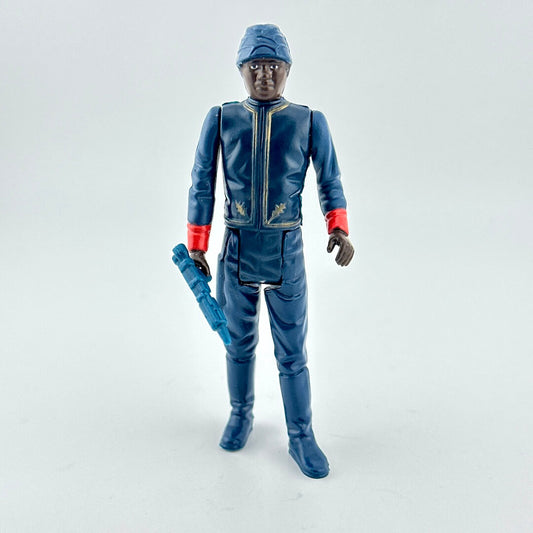 Action figure in blue suit with red and gold accents with weapon on white background. 