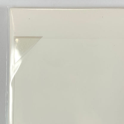 Top left corner of print tucked into protective corner, sleeved in plastic. 
