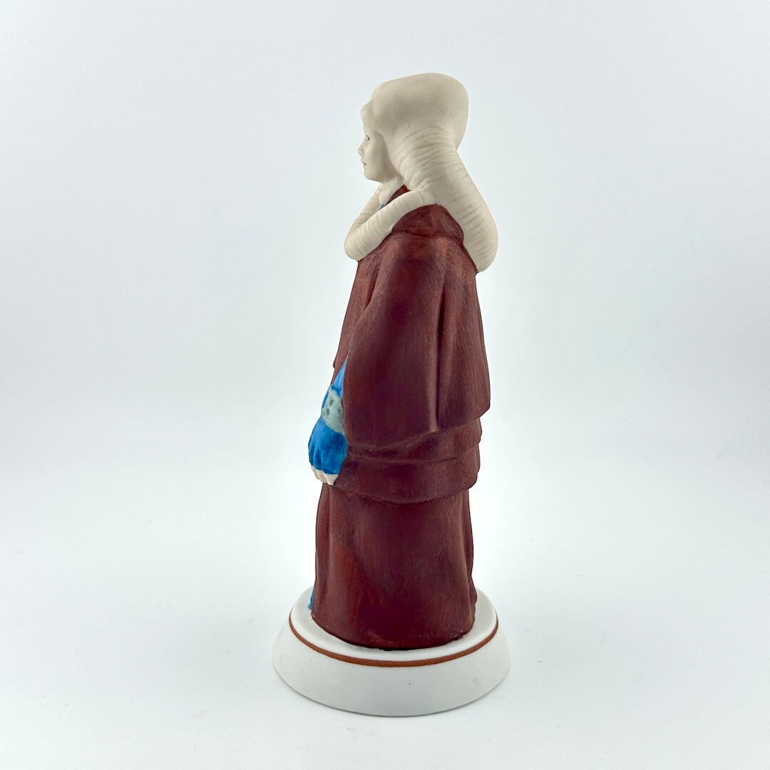 Star Wars figurine with tag on white background. 