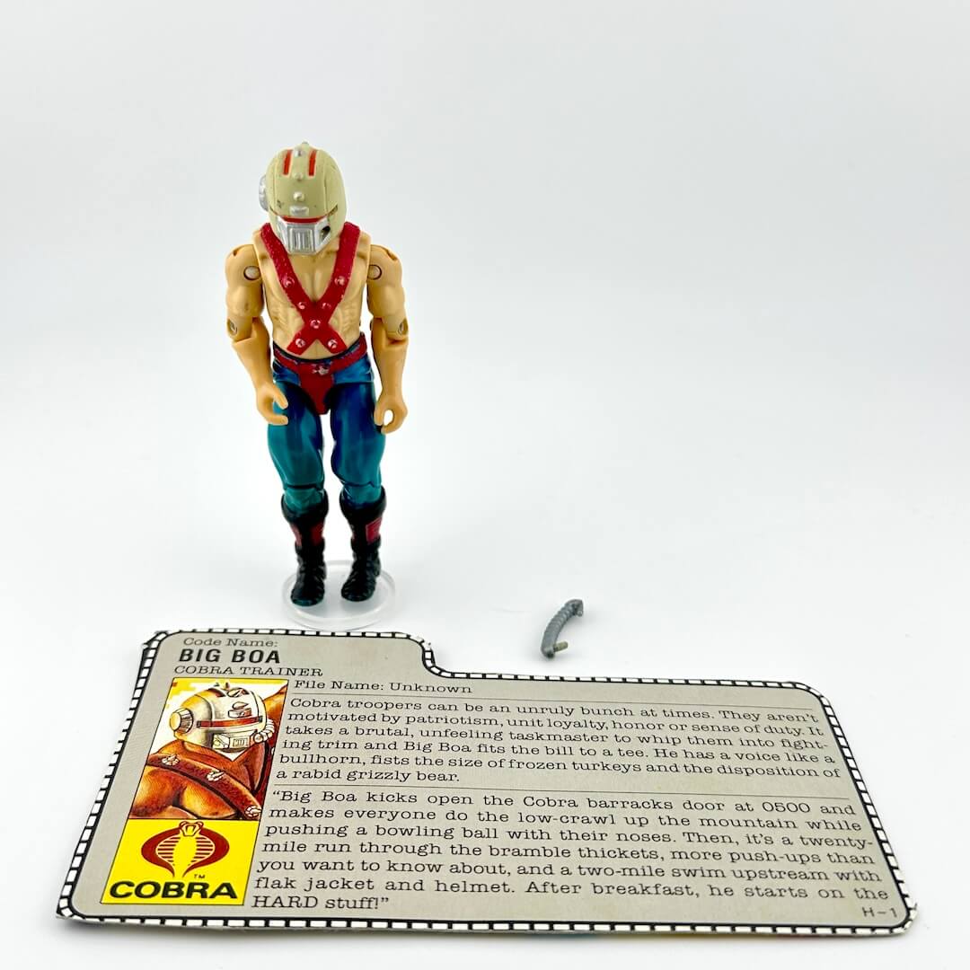 Toy figure with a card on a white background