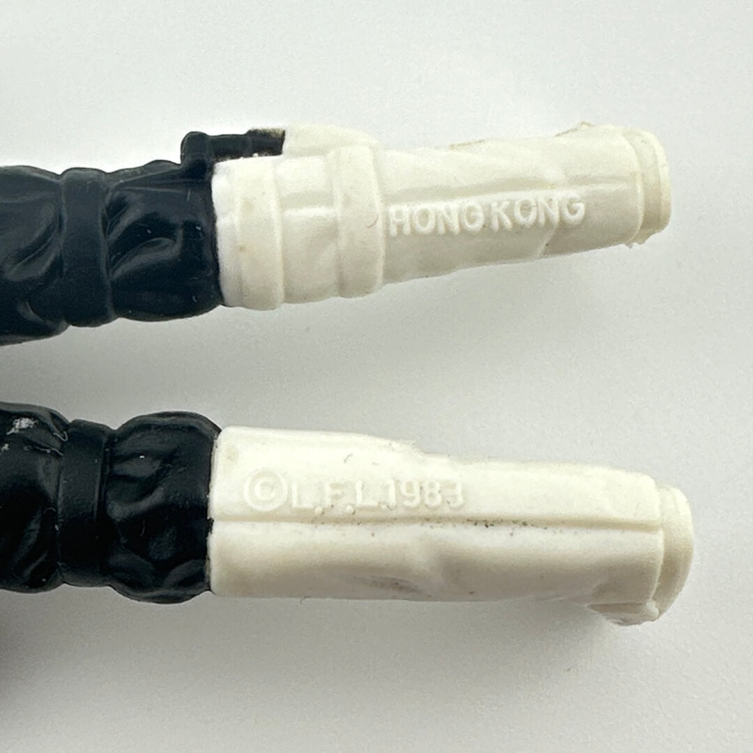 Close-up of back of figure's legs to show COO and copyright information. 