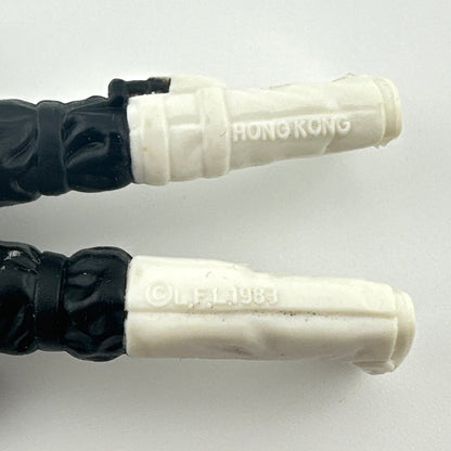 Close-up of back of figure's legs to show COO and copyright information. 