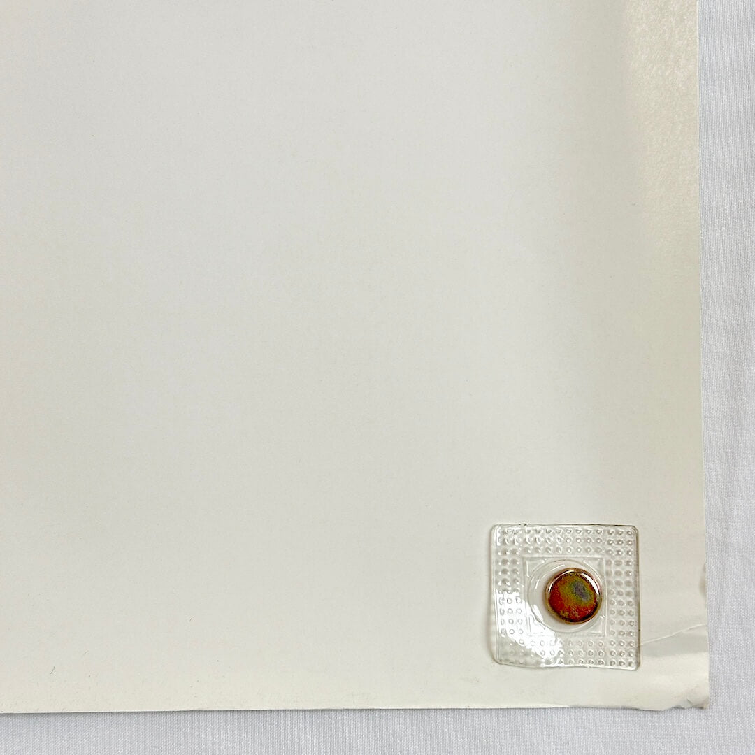 Bottom right corner with crease and wear to corner. 