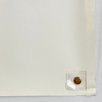 Bottom right corner with crease and wear to corner. 