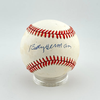 Baseball with red stitching on a white background