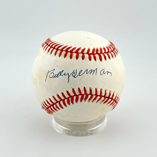 Baseball with red stitching on a white background
