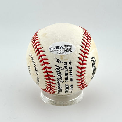 Baseball with JSA authentication label on a white background