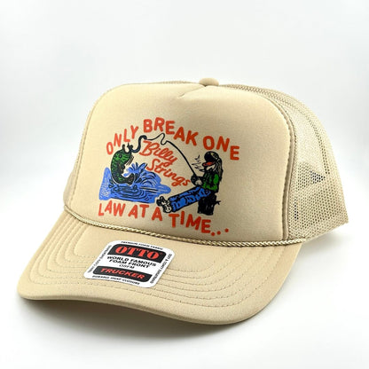 Beige cap with fishing graphic and text on a white background