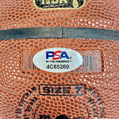 Close-up of a basketball with a PSA grading label and size marking.