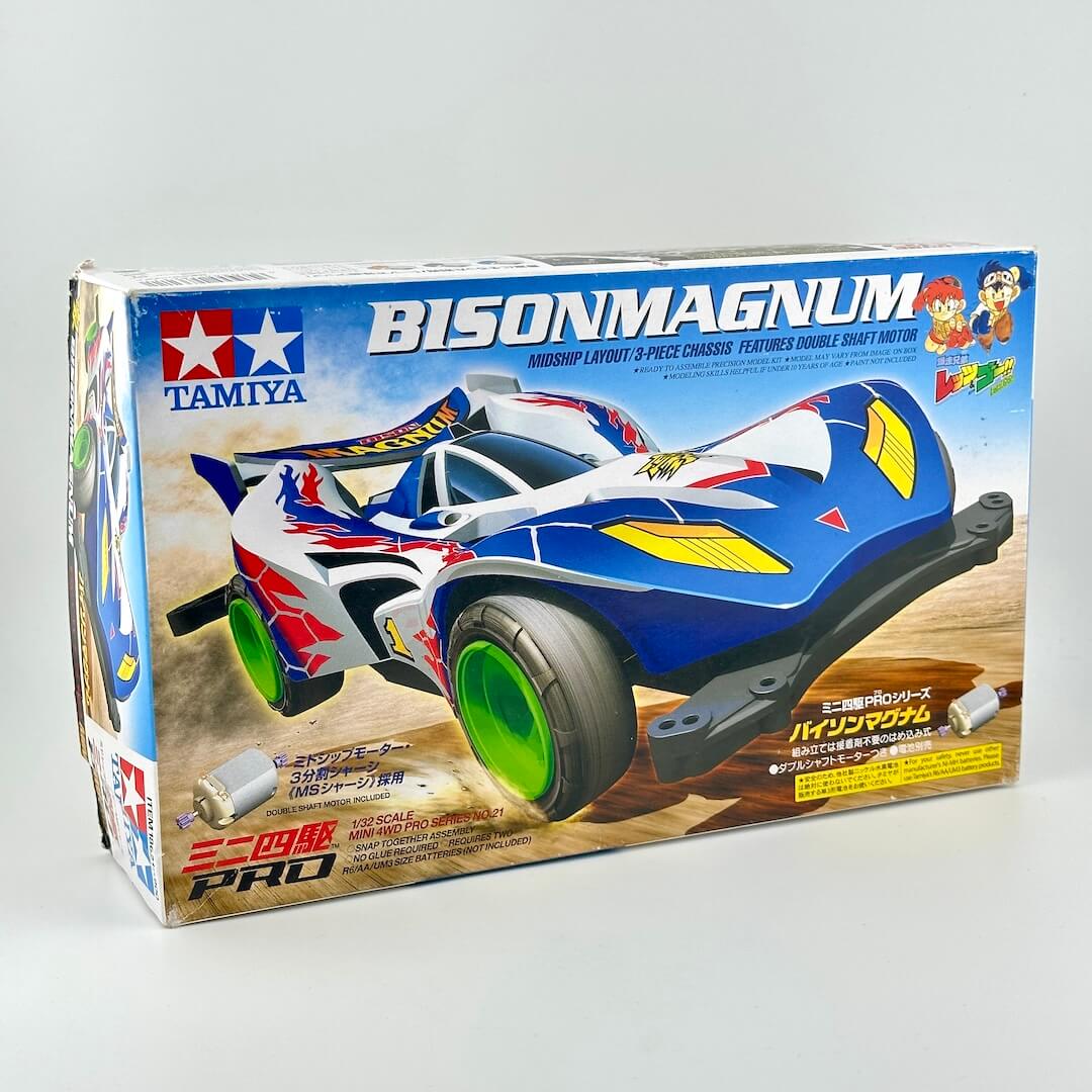 Tamiya Bison Magnum 1/12 scale model car kit in its original retail packaging, featuring a blue, white, and yellow race car.