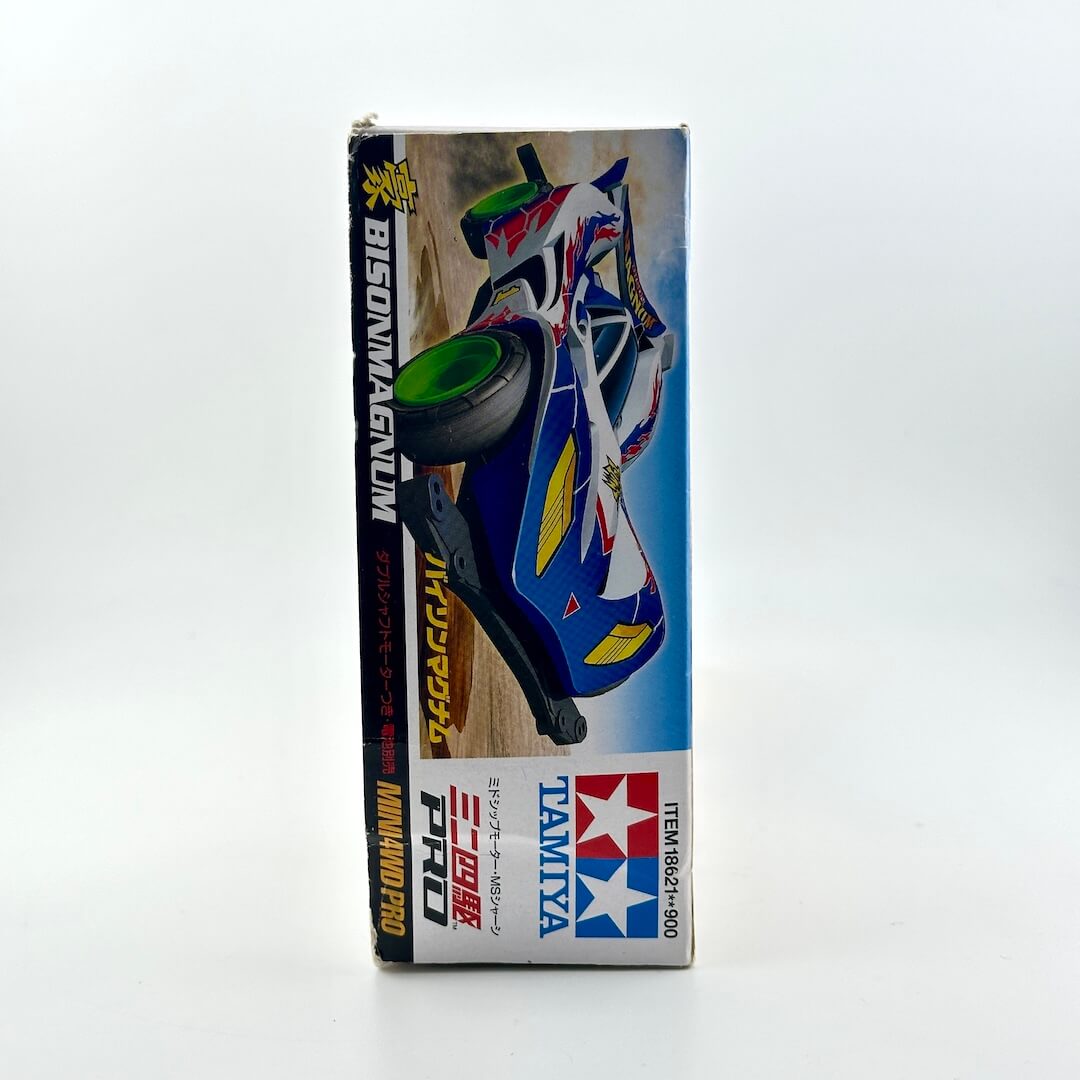Tamiya Bison Magnum 1/12 scale model kit box, featuring a blue, white, and red racing car illustration on a clean white background.