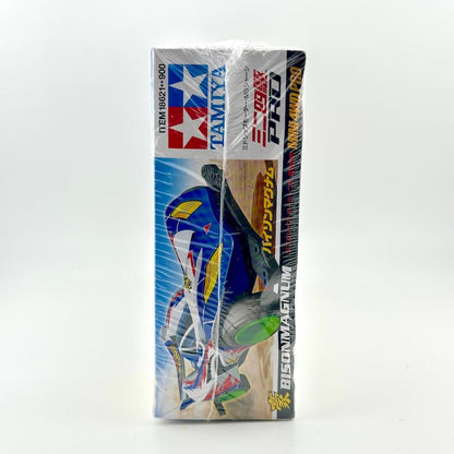 Side view of packaging showing sealed model kit for race car. 