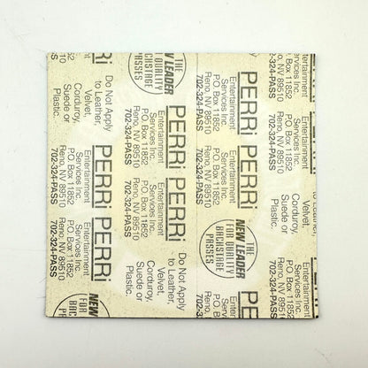 Backside of patch showing intact paper backing and mint condition. 