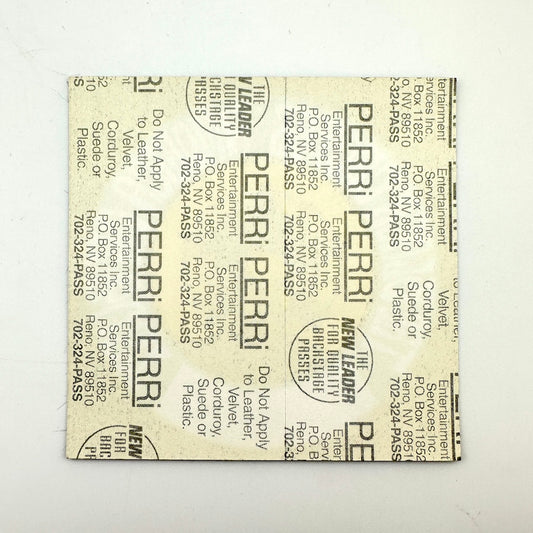 Backside of patch showing intact paper backing and mint condition. 