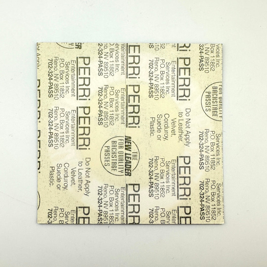 Backside of patch showing intact paper backing and mitn condition. 