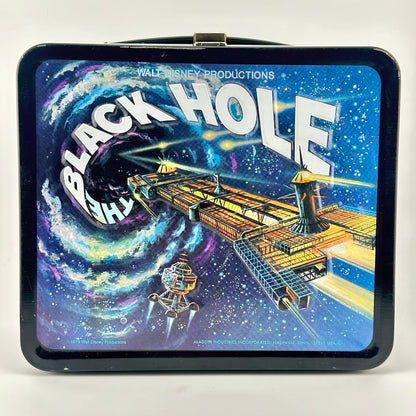 A square black metal lunch box featuring a colorful sci-fi illustration of a spaceship and a swirling black hole.