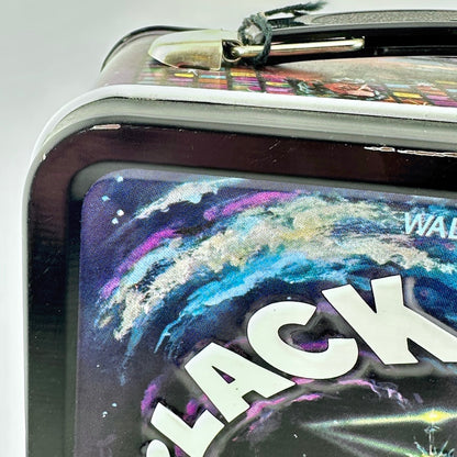 Close-up of a rectangular metal lunch box featuring a colorful galaxy space design.'